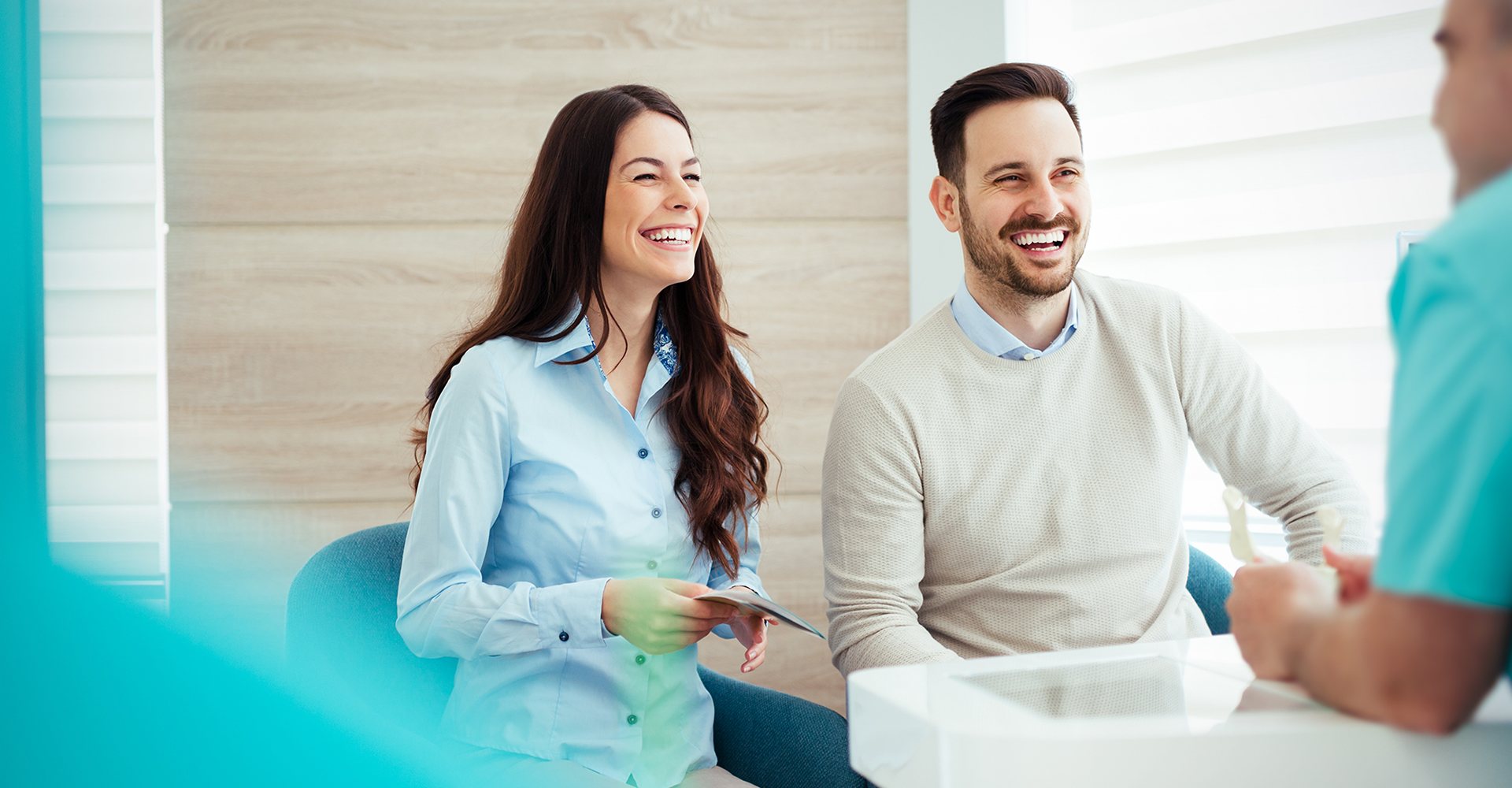 Smiling patients at a dentist office