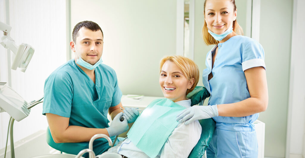 Image of a happy woman with her dentist