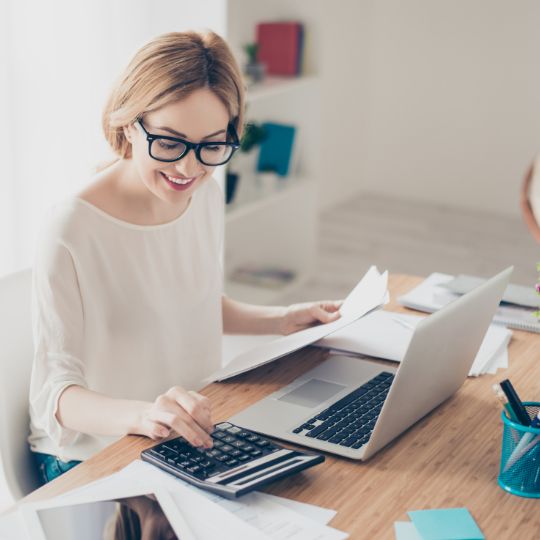 A billing specialist working at her desk