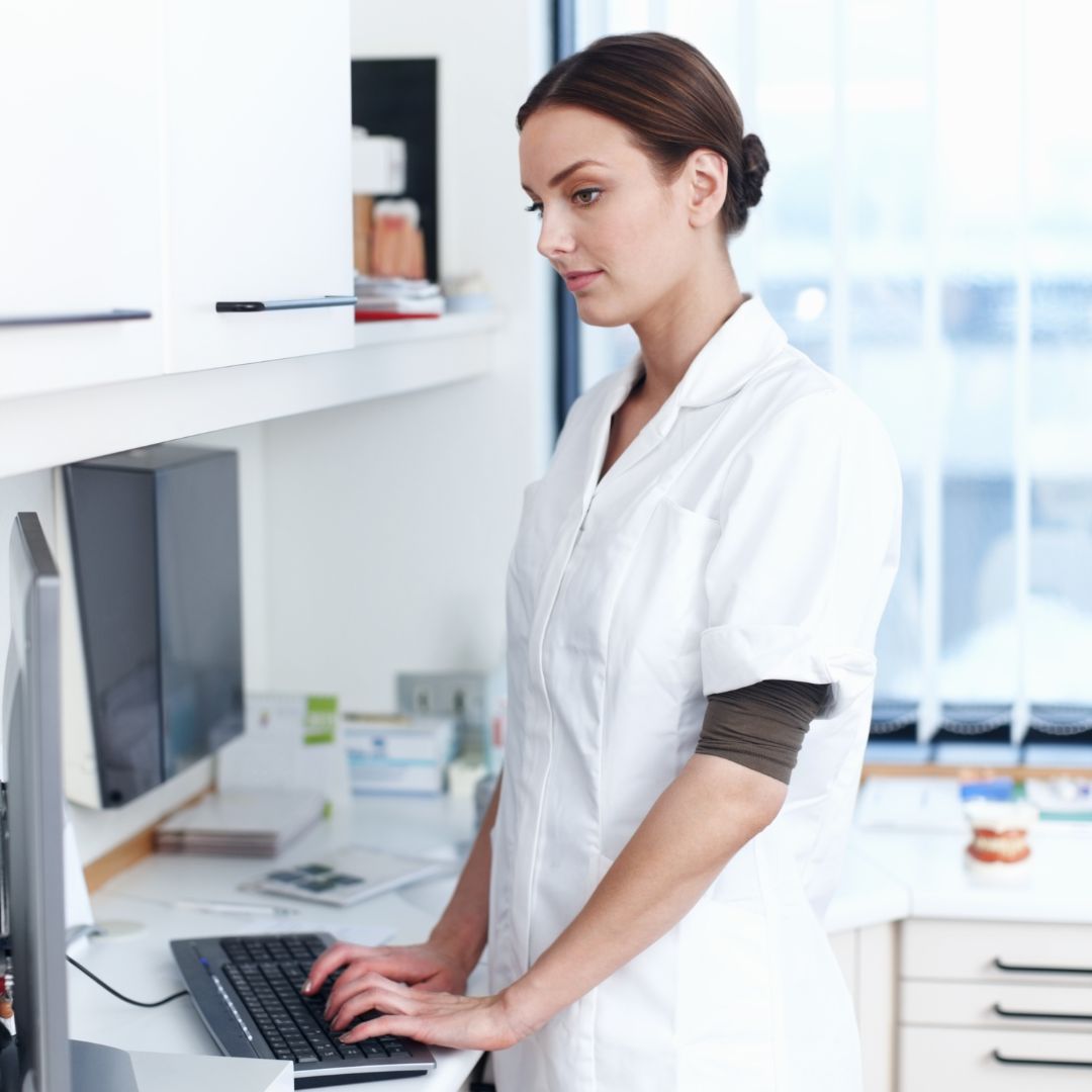 dentist working on computer