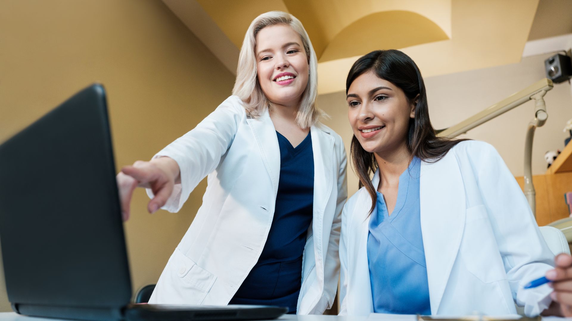 two dentists at computer