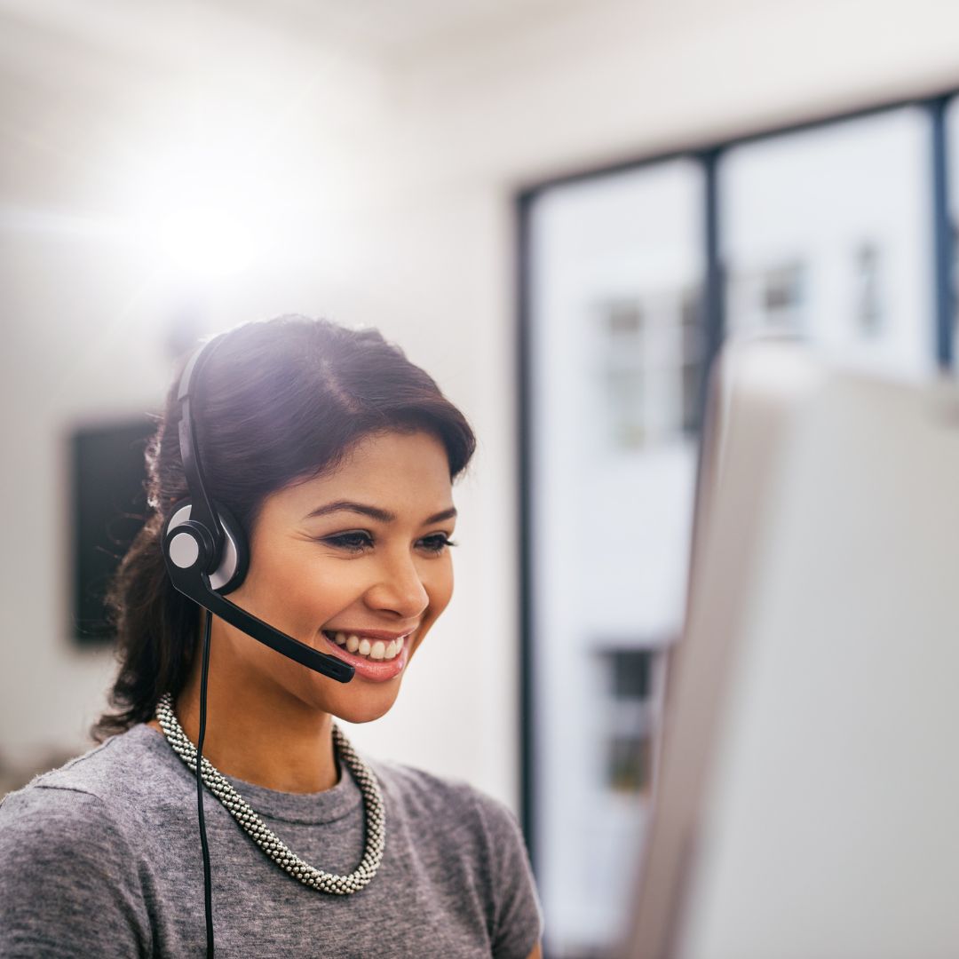 a smiling woman on the phone