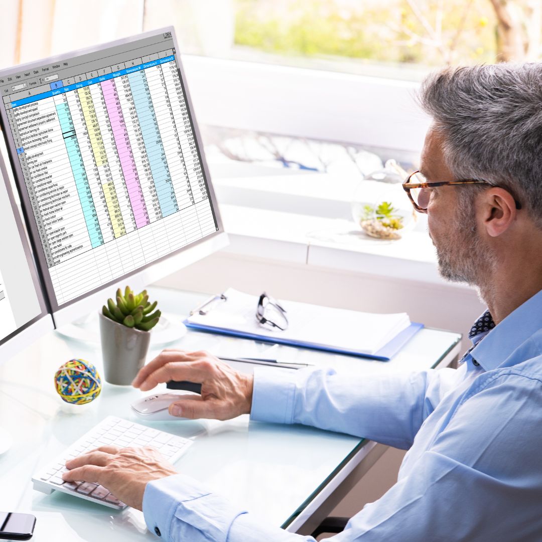 a dentist looking over a spreadsheet