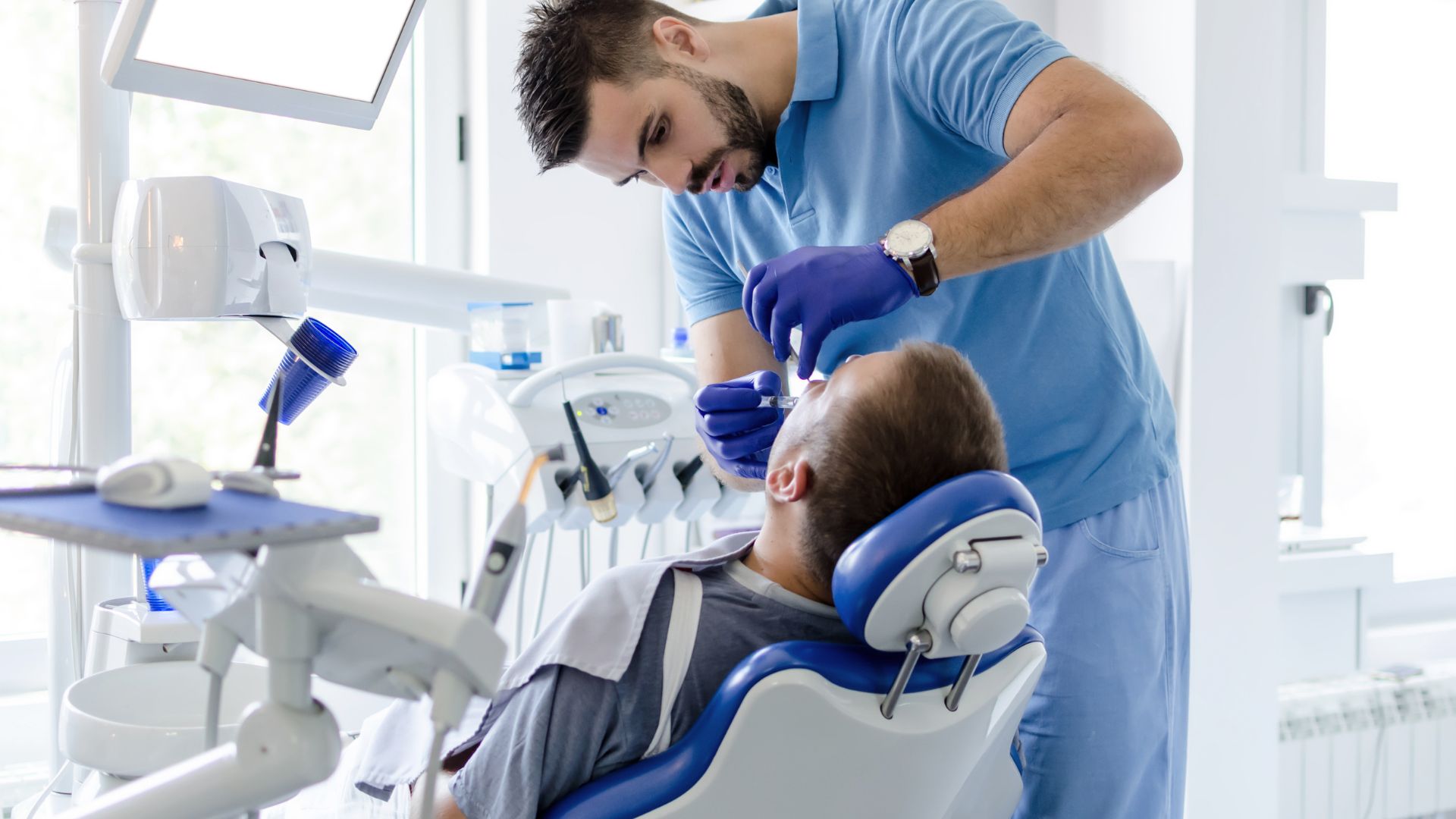 a dentist working on a patient